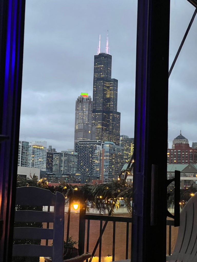 Willis Tower at dusk seen through condo windows in the South Loop