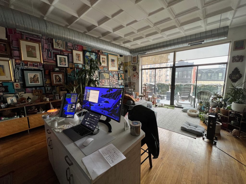Open living space with Art Deco coffered ceiling and floor-to-ceiling windows in a South Loop Chicago loft condo