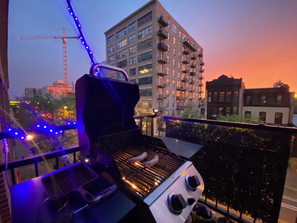 Private balcony with grill at sunset, South Loop Chicago